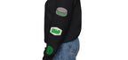 Woman wearing black Dallas-themed crewneck sweatshirt with green and white custom patches on the left sleeve, including dallas hockey patch and hockey puck. Streetwear fit from Sunday Club.